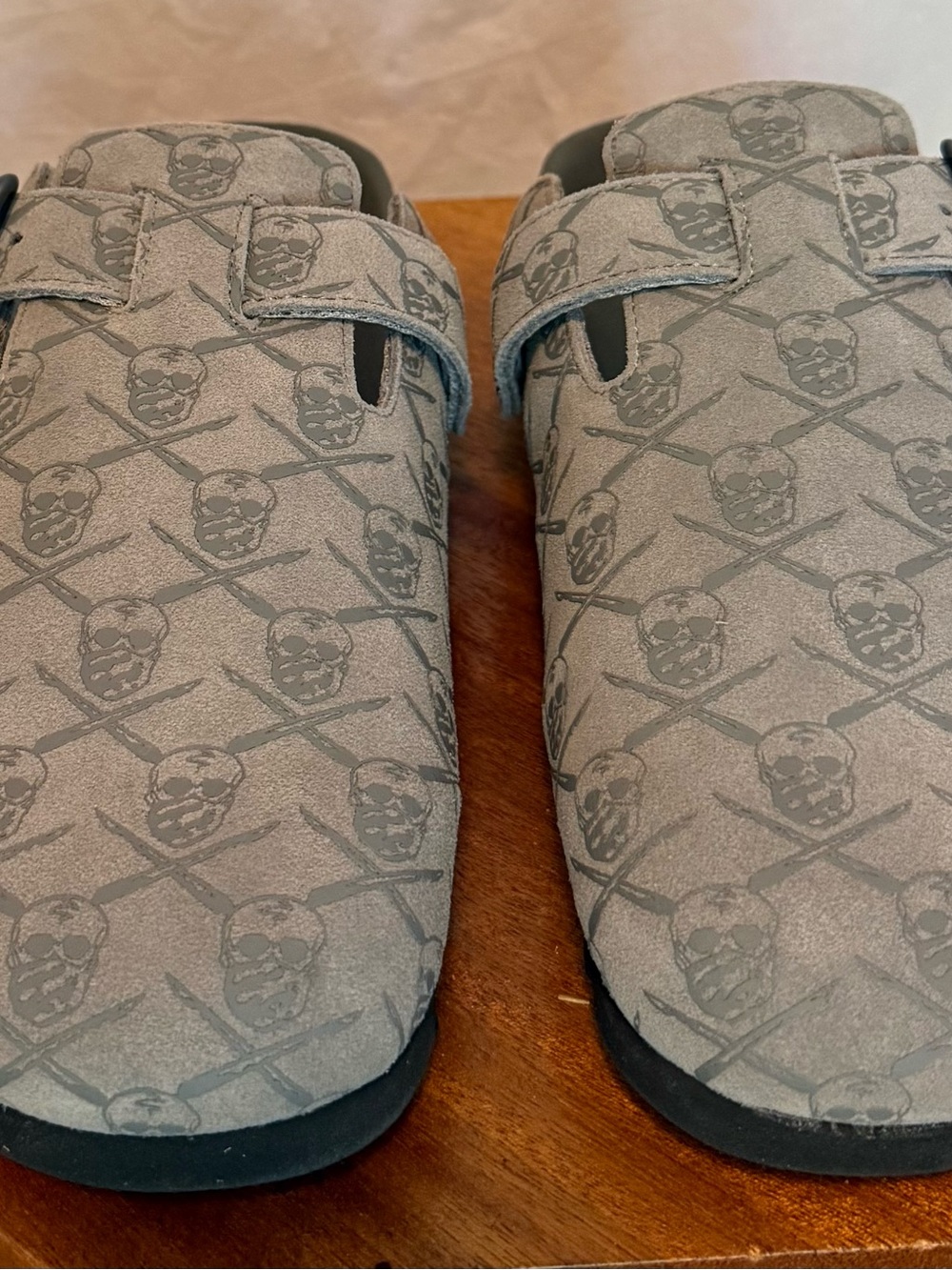 Men's SRGN mule in grey by The Surgeon with skull and crossbones pattern.